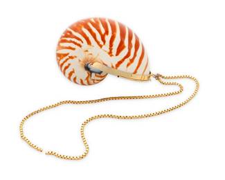 1091
Judith Leiber: A Vintage Striped Nautilus Shell Minaudière
Circa 1970s/1980s, a brown and white striped shell, with metallic leather lining and gold metal frame with hinged lid, with short gold-toned metal chain, signed to interior plaque
4 3/4 in. H x 2 3/8 in. W x 3 1/2 in. D
Estimate: $400 - $600