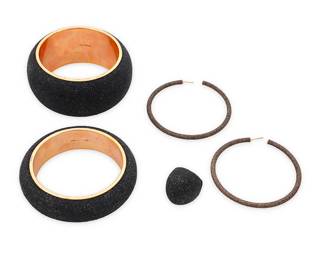 1070
Pesavento: A Group of 'Polvere Di Sogni' Sterling Silver Jewelry
Featuring two chunky domed bangle bracelets in rose gold-plated sterling silver and dark brown 'polvere' powdered glitter, with a matching domed cocktail ring, as well as a pair of large pale brown polvere hoop earrings, each signed and with Italian assay marks
5 pieces
Bangles: 8 1/4 in. inner C.; Ring size: 7 1/2; earrings: 2.5 in. Dia.
222.1 grams gross
Estimate: $700 - $900