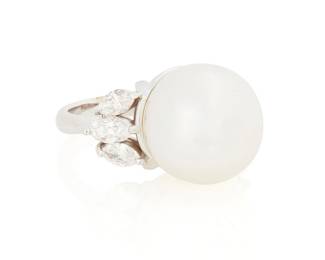 1166
An 18K White Gold, Cultured Pearl and Diamond Ring
Centering a white cultured pearl measuring approximately 13.20 mm, accented by six marquise-shaped diamonds weighing approximately 0.85 carat
Size: 5
8.3 grams gross
Estimate: $700 - $1,000