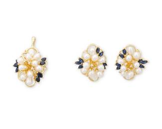 1127
A 14K Gold, Freshwater Pearl and Sapphire Set
Including a pendant and pair of earrings of the same design featuring a cluster of freshwater pearls, accented by marquise sapphire and round diamonds
3 pieces
Pendant: 2 x 1 in., Earrings: 1 x 7/8 in.
17.74 grams gross
Estimate: $600 - $800