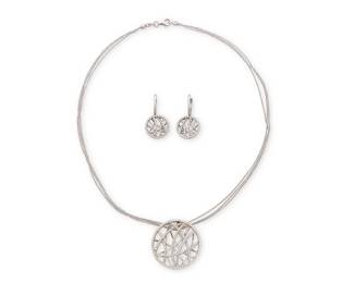 1026
Carriere: An 18K White Gold and Diamond Necklace and Earring Set
Of an organic lattice design set with round diamonds weighing approximately 2.10 carats, signed Carriere
3 pieces
Necklace: 15 in. Pendant: 1 in., Earrings: 1 x 5/8 in.
17.3 grams gross
Estimate: $800 - $1,200