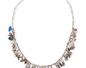 1084
A Sterling Silver Charm Necklace
Featuring a long 'Treasure' necklace with various sterling silver and mixed metal charms of a myriad of nostalgic and souvenir subjects including fish, lobsters, a drum, a sled, dressing table, bird house, cowboy, lucky horseshoes and dancing figures, all suspended on a silver metal chain
Length: 27 in.
84.0 grams gross
Estimate: $200 - $300
