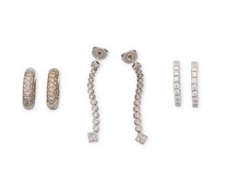 1175
A Group of Three Pairs of 18K White Gold and Diamond Earrings
Including a long-articulated pair accented by round diamonds, a pair of small hoops set with round diamonds and a pair of pave set diamond huggie hoops
6 pieces
Measures: 1 1/2 in., 3/4 in., 5/8 in.
14.9 grams gross
Estimate: $700 - $900