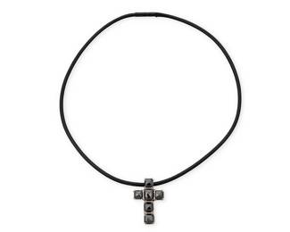 1168
An 14K White Gold and Black Diamond Necklace
Featuring a braided black corn suspending a white gold and six top faceted black diamonds cross pendant
Length: 18 in., Pendant: 1 1/2 x 1 in.
12.6 grams gross
Estimate: $600 - $800