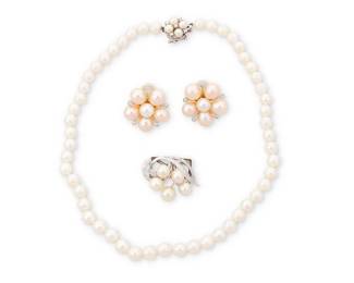1158
A Group of White Gold and Cultured Pearl Jewelry
Including a single cultured pearl strand, a pair of cluster cultured pearl ear clips and a clasp turned brooch with a floral design
4 pieces
Necklace: 14 in., Earrings: 7/8 x 7/8 in., Brooch: 1 1/8 x 3/4 in.
37.7 grams gross
Estimate: $800 - $1,200
