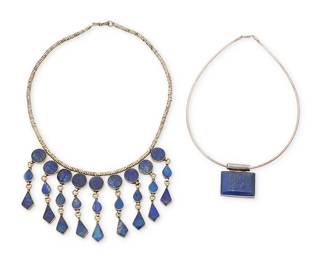 1162
Two Lapis Lazuli Necklaces
Comprising a sterling silver choker necklace with a rectangular set lapis pendant and a silver-toned mixed metal fringe necklace with nine set lapis lazuli dangles
2 pieces
Choker: 16 in. x 1 3/8 in.; necklace: 19 1/4 in. x 2 3/4 in.
103.3 grams gross
Estimate: $200 - $400