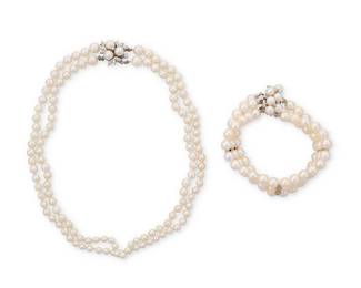 1179
A White Gold, Cultured Pearl and Diamond Necklace and Bracelet
Including a necklace of two strands of graduated pearls finished with a white gold and diamond clasp together with a three-strand cultured pearl bracelet with a white gold and diamond clasp
2 pieces
Necklace: 14 in., Bracelet: 6 3/4 in.
73.8 grams gross
Estimate: $400 - $600