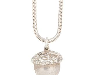 1060
A Sterling Silver Acorn Pendant with a Tiffany & Co. Sterling Silver Chain
Featuring a sterling silver acorn pendant suspended from a Tiffany & Co. sterling silver chain, chain signed to hangtag at clasp
Length: 28 1/2 in.; Pendant: 1 x 7/8 in.
33.2 grams gross
Estimate: $300 - $500