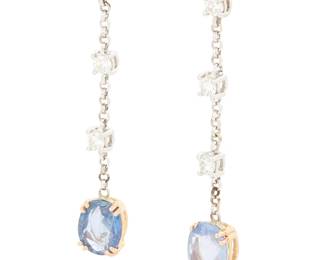 1025
A Pair of 18K Bi-Color Gold, Sapphire and Diamond Earrings
Centering two oval sapphires weighing approximately 2.00 carats each, suspended from three round diamond stations weighing approximately 0.54 carats total
2 pieces
Measures: 1 3/4 in.
4.98 grams gross
Estimate: $800 - $1,200