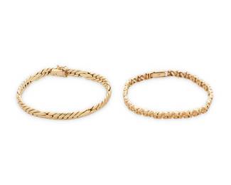 1142
Two Gold Bracelets
Including a 14k gold fancy curb link bracelet, together with a 10k gold nugget style link bracelet
2 pieces
Measures: 6 3/4 in. and 7 in.
25.0 grams gross
Estimate: $800 - $1,200