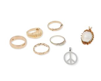1139
A Group of Bi-Color Gold Jewelry
Including three 18k gold rings, two 14k gold rings, a 14k gold and mabe pearl pendant together with a 14k white old peace sign pendant
7 pieces
Rings: 5 3/4 - 7. Pendants: 7/8 in., 5/8 in.
25.6 grams gross
Estimate: $1,200 - $1,800