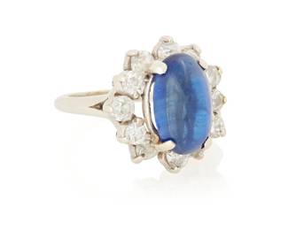 1154
A 14K White Gold, Sapphire and Diamond Ring
Centering an oval sapphire double cabochon weighing approximately 8.40 carats encircled by round and old European-cut diamonds weighing approximately 1.20 carats
Size: 7 1/4
6.7 grams gross
Estimate: $800 - $1,200