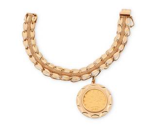 1006
A Gold Coin Charm Bracelet
Featuring a 22k gold Liberty Head coin suspended from a 14k gold fancy link bracelet
Length: 7 in., Pendant: 1 1/2 x 1 1/4 in.
30.8 grams gross
Estimate: $1,500 - $2,000