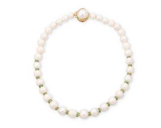 1046
A 14K Gold, Cultured Pearl and Emerald Necklace
Featuring cultured pearl beads measuring approximately 10.15-14.50 mm, accented by gold rondelles set with round emeralds, finished with a mabe pearl, emerald and Greek key clasp
Length: 20 in., Clasp 7/8 x 7/8 in.
105.4 grams gross
Estimate: $1,000 - $2,000
