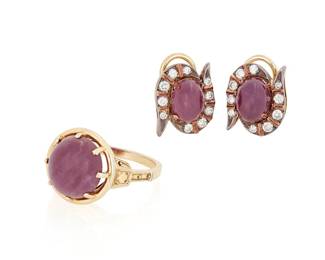 1131
A Ruby and Diamond Ring and Earring Set
Including a gold plated platinum and round ruby cabochon ring together with a pair of silver topped-gold earrings featuring an oval ruby cabochon and round diamonds
3 pieces
Ring: 5, Earrings: 5/ x 1/2 in.
12.6 grams gross
Estimate: $800 - $1,200