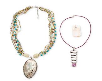 1163
A Group of Shell and Freshwater Pearl Jewelry
Comprising a multi-strand beaded necklace suspending an abalone seashell pendant, as well as a sterling silver pendant with graduated stacked freshwater pearls and set amethyst, on a purple leather choker cord, and a white shell pendant featuring multiple blister pearls, two marked for sterling
4 pieces
Necklace: 24 in. L x 3 in. H; pearl choker: 16 in. L x 3 in. H; pendant: 2 in. H;
115.0 grams gross
Estimate: $200 - $400