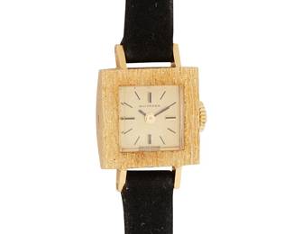 1187
Bucherer: An 18K Gold Watch
Dial:10.00 mm, square with baton hour markers
Case: 15.50 mm
Closure: black suede strap with gold plated buckle clasp
Signed: dial
Inner circumference: 6 - 7in.
12.8 grams gross
Estimate: $500 - $700