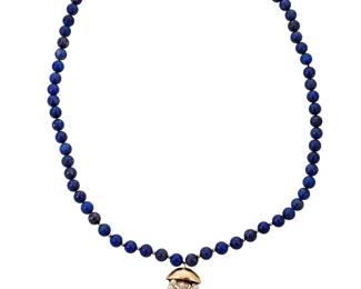 1041
A Gold, Lapis Lazuli and Cultured Pearl Necklace
Of a single strand design featuring lapis lazuli beads measuring approximately 11.70 mm, finished with a 14k gold capped tassel of round cultured pearl and lapis lazuli beads, finished with a gold plated clasp
Length; 32 in., Tassel:3 in.
159.5 grams gross
Estimate: $800 - $1,200
