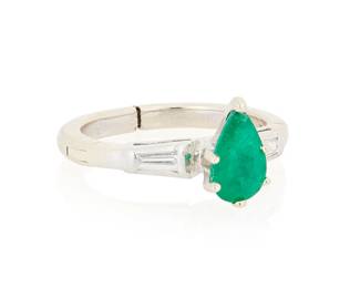 1031
An 18K White Gold, Emerald and Diamond Ring
Centering a pear-shaped emerald weighing approximately 0.81 carats, flanked by baguette diamonds
Size: 5 with hinged shank
3.6 gram gross
Estimate: $400 - $600