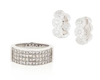 1052
A White Gold and Diamond Ring and Earrings
Including an 18k white gold ring set with princess-cut diamonds weighing approximately: 1.68 carats, signed Carriere, together with a pair of 18k white gold and diamond hoop earrings set with round and baguette diamonds weighing approximately 1.32 carats
3 pieces
Ring: 7, Earrings: 5/8 in.
17.5 grams
Estimate: $500 - $700