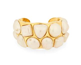 1095
CHANEL: A Vintage 1990s Gold Tone and Faux Pearl Cuff
A chunky tapered cuff bracelet with large inset faux pearls, signed to plaque: Chanel; Made in France; [Season] 26

Inner circumference: 6 1/2 in., including gap: 1 in.
94.0 grams gross
Estimate: $300 - $500