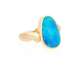 1001
An 18K Gold and Opal Ring
Featuring an organic-shaped opal cabochon measuring approximately 15.14 x 9.16 mm, accented by round diamonds
Size: 5 1/4
6.76 grams gross
Estimate: $500 - $700