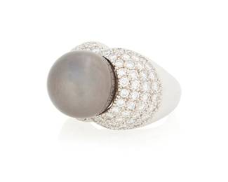 1038
An 18K White Gold, Colored Cultured Pearl and Diamond Ring
Featuring an round grey cultured pearl measuring approximately 12.94 mm, accented by round diamond weighing approximately 1.64 carats
Size: 5 1/2
16.1 grams gross
Estimate: $700 - $1,000