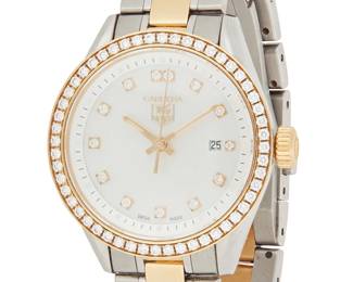 1183
Carrera and Tag Heuer: A Stainless Steel, Gold and Diamond Watch
Dial:24.00 mm, round with diamond set numerals, encircled by round diamonds weighing approximately 0.50 carat
Case: 30.00 mm
Case number: EKK4888
Closure: stainless-steel and plated link bracelet with a deployment clasp
Signed: dial, case and clasp
Inner circumference:5 1/2 in.
63.2 grams gross
Estimate: $600 - $800
