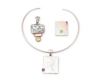 1089
A Group of Silver and Shell Pendants
Comprising two sterling silver rectangular mother of pearl pendants, one with set amethyst suspended from a mixed metal wire choker and one with set peridot, as well as a stacked sterling silver pendant with mother-of-pearl checkerboard inlay, a freshwater pearl and set citrine gemstone, two marked for sterling
4 pieces
Choker: 14 1/4 in. L x 2 3/8 in. H; pendants: 2 3/4 in. H & 1 1/2 in. H
79.0 grams gross
Estimate: $200 - $400