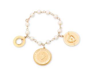 1124
A Gold and Cultured Pearl Charm Bracelet
Featuring a 14k gold St. Christopher charm, a 14k gold heart charm and a gold-filled ring charm on a gold-filled and cultured pearl bracelet
Length: 6 1/2 in.
25 grams gross
Estimate: $1,000 - $1,500