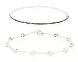 1160
Two 18K White Gold and Diamond Bracelets
Including an oval hinged bangle set with round black diamonds, signed Bony Levy together with a bar link white gold bracelet accented by round diamonds weighing approximately 0,87 carat
2 pieces
Length: 6 1/2 and 6 3/4 in.
15.8 grams gross
Estimate: $700 - $900