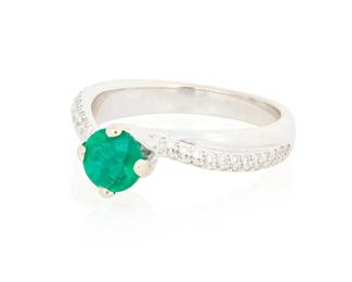 1047
An 18K White Gold, Emerald and Diamond Ring
Centering a round emerald weighing approximately 1.10 carats, accented by round diamonds
Size: 7
5.6 grams gross
Estimate: $700 - $900