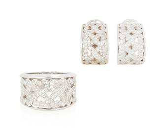 1176
An 18K White Gold and Diamond Set
Including a ring and pair of earrings featuring a double heart design all set with round diamonds weighing approximately 1.75 carats total, with Italian marks
3 pieces
Ring: 6 1/2, Earrings: 3/4 x 1/2 in.
23.9 grams gross
Estimate: $800 - $1,200