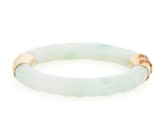 1140
A 14K Gold and Jade Bangle
Of a hinged design featuring carved twining floral motifs finished with and etched 14K gold clasp
Inner circumference: 6 3/4 in.
50.4 grams gross
Estimate: $300 - $500