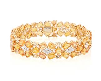 1009
A 14K Gold, Citrine, Diamond and Colorless Stone Bracelet
Featuring oval citrines in a floral design, accented by colorless stones and round diamonds
Length: 7 1/4 in., Width: 1/2 in.
28.13 grams gross
Estimate: $800 - $1,200