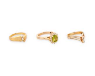1017
A Group of Gold, Gem-Set and Diamond Rings
Including a 14k gold, peridot and diamond ring with hinged shank, a 14k gold and three stone diamond ring, together with an 18k gold and diamond chevron ring
3 pieces
Size: 8 1/2, 8 and 8 3/4
15.6 grams gross
Estimate: $600 - $800