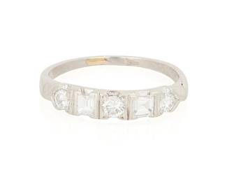 1161
A Platinum and Diamond Ring
Featuring square-cut and round diamonds
Size: 5 1/2
2.7 grams gross
Estimate: $500 - $700