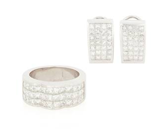 1177
An 18K White Gold and Diamond Ring and Earring Set
Including a pair of earrings with channel-set with princess-cut diamonds weighing approximately 1.80 carats together with a scalloped shaped ring channel-set with princess-cut diamonds weighing approximately 2.25 carats
3 pieces
Ring: 6, Earrings: 5/8 x 3/8 in.
23.1 grams gross
Estimate: $800 - $1,200