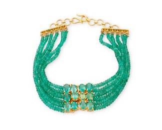 1113
An 18K Gold and Emerald Bracelet
Featuring six strands of faceted emeralds beads centering a former clasp set with twelve oval emeralds
Length: 6 - 9 in.
24.4 grams gross
Estimate: $500 - $700