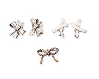 1059
Tiffany & Co.: A Group of Vintage Sterling Silver Jewelry
Featuring a pair of Paloma Picasso for Tiffany & Co. sterling silver 'X' pierced earrings, circa 1985, as well as a pair of Angela Cummings sterling silver bow clip earrings, circa 1984 (post T & Co.), and a Tiffany & Co. diminutive sterling silver and 18K gold bow brooch, all signed to reverse
5 pieces
Earrings: 1 1/4 x 1 in.; brooch: 1 x 1 1/4 in.
33.6 grams gross
Estimate: $300 - $500
