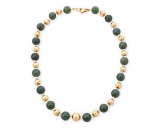 1040
An 18K Gold, Nephrite and Cultured Pearl Necklace
Featuring large nephrite beads measuring approximately 13.20 mm, accented by cultured pearls and 18k gold hollow beads
Length: 22 in.
99.0 grams gross
Estimate: $800 - $1,200