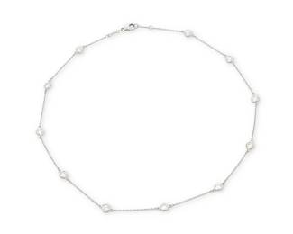 1021
Tiffany & Co.: A Platinum and Diamond 'Diamonds by the Yard' Necklace
Featuring eleven round diamond stations weighing approximately 2.20 carats, signed Tiffany & Co.
Length: 14 1/2 in.
4.65 grams gross
Estimate: $2,000 - $3,000