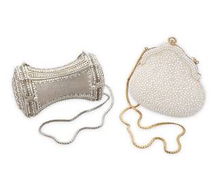 1092
Judith Leiber: Two Vintage Evening Bags
Circa 1970s/1980s, comprising a 'Chatelaine' bag encrusted with white beads and lined with metallic gold leather, with a gold-toned chain strap, and a brushed silver-toned tapered 'hourglass' minaudière bag featuring a hinged lidded compartment at each end lined with silver metallic leather, and trimmed with clear crystals and with a silver-toned chain strap, each bag signed to interior
White: 5 1/4 in. H x 4 3/4 in. W x 2 1/4 in. D
Silver: 3 1/4 in. H x 5 1/4 in. W x 2 3/4 in. D
Estimate: $600 - $800