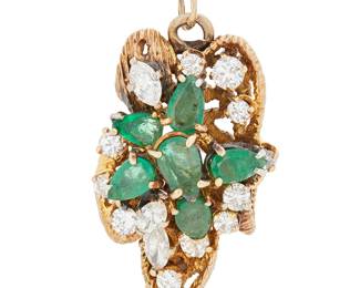 1141
A 14K Gold, Emerald and Diamond Pendant
Of an organic design set with pear-shaped emeralds and accented by round and marquise-shaped diamonds weighing approximately 1.35 carats
Measures: 1 3/8 in x 3/4 in.
10.6 grams gross
Estimate: $700 - $1,000