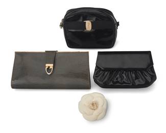 1093
A Group of Vintage Luxury Items
Late 20th century
Four works:
CHANEL: A large floral Camellia brooch in white piqué fabric, likely 1990, with CC hang tag verso: Chanel / Made in France
4 in Dia. x 1 1/4 in. H
Judith Leiber: A black patent leather gusseted front flap clutch bag with gathered front and back pocket, removable shoulder strap, and black satin lining, signed to interior plaque
5 in. H x 8 1/4 in. W x 2 in. D; strap drop: 19 in.
Salvatore Ferragamo: A black patent leather camera bag-style shoulder bag, with front branded medallion and grosgrain ribbon trim, with zip top and black leather lining, signed and numbered to interior: 0 213095 / Made in Italy
6 in. H x 7 1/2 in. W x 2 3/4 in. D; strap drop: 21 1/2 in.
Gucci: A gray snakeskin gusseted clutch purse with frame top and 'G' strap clasp, lined with smooth leather and signed to interior plaque: Gucci / Italy
5 in. H x 10 3/4 in. W x 1 3/4 in. D
4 pieces total
Estimate: $400 - $600