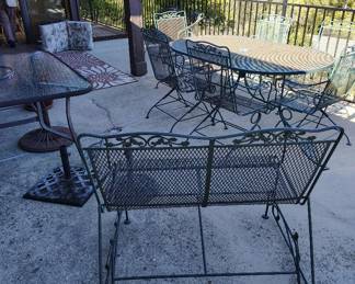 Mid Century Wrought Iron Glider, oval table with 6 chairs, umbrella stands