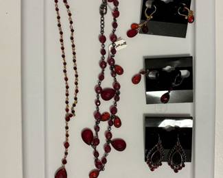 Carolee - red colored stone designs