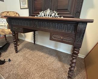 Beautiful antique desk in the “hers” upstairs office. Barley twist legs and leather writing surface.