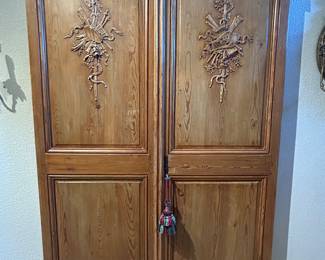 1800’s French carved wooden doors. These have been mounted as a wall display.