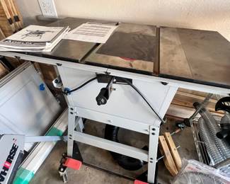 Delta Table saw with attached hose for dust collecting